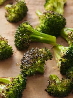 oven roasted broccoli on a baking sheet