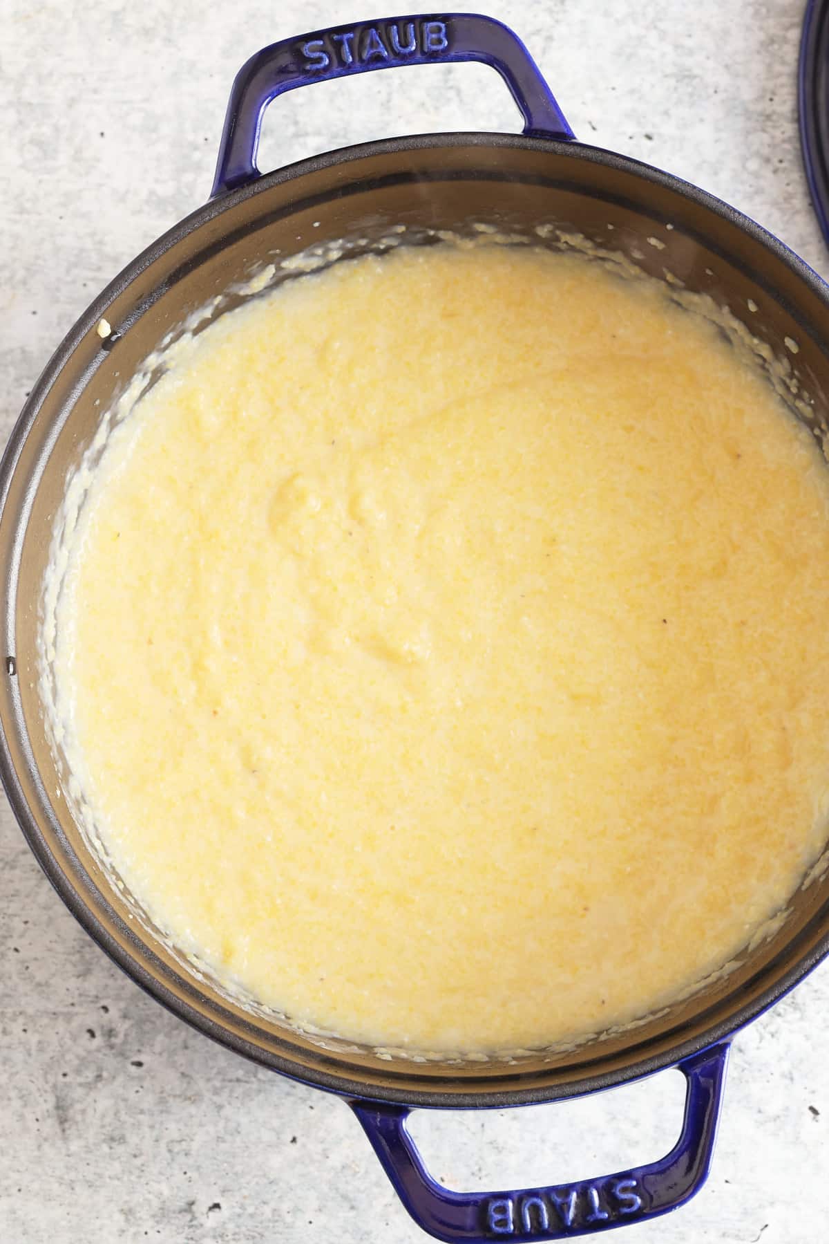 In a medium heavy-bottom saucepaWhisk the polenta into the boiling water, then reduce the heat to low.