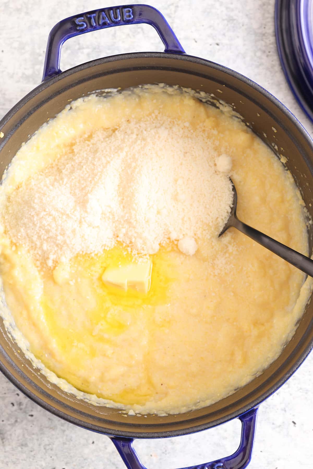 Cooked creamy polenta with butter and cheese added. 