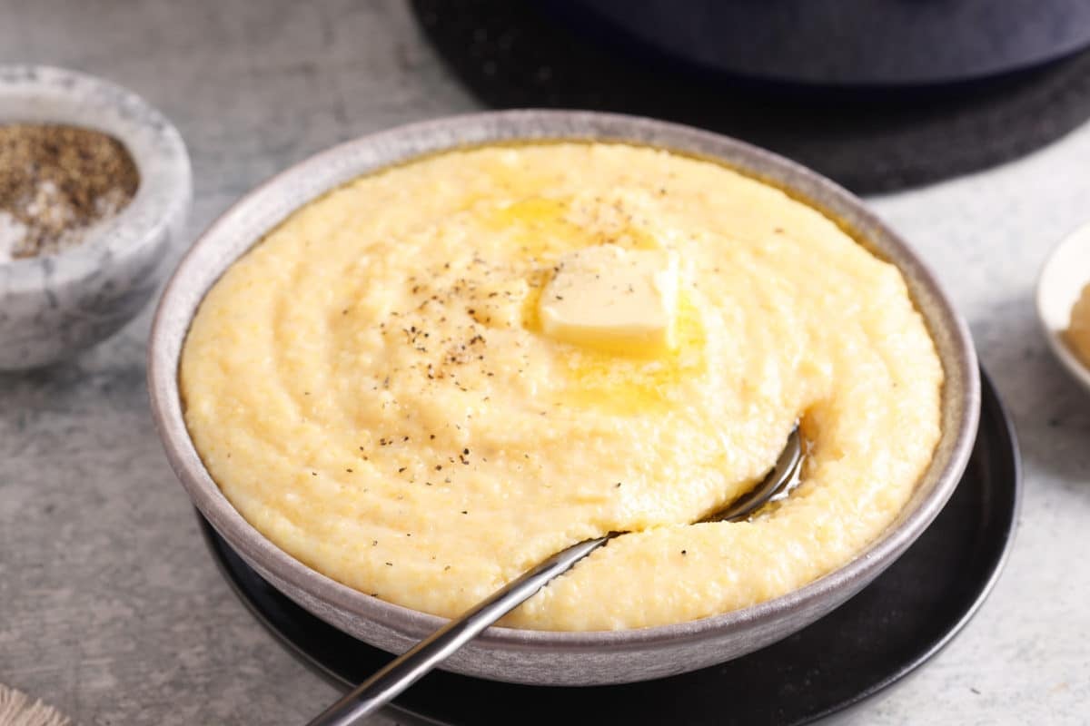Creamy Polenta Recipe in a bowl with a spoon.
