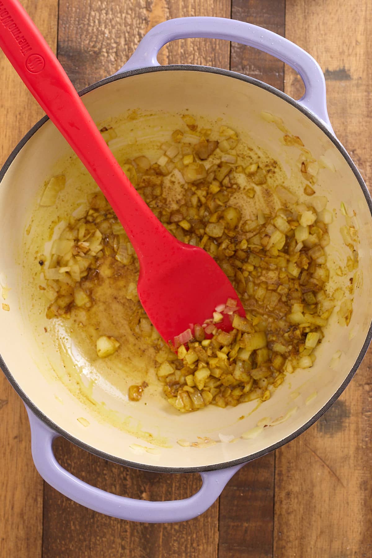 Dutch oven with olive oil, sauteed onions, garlic and spices