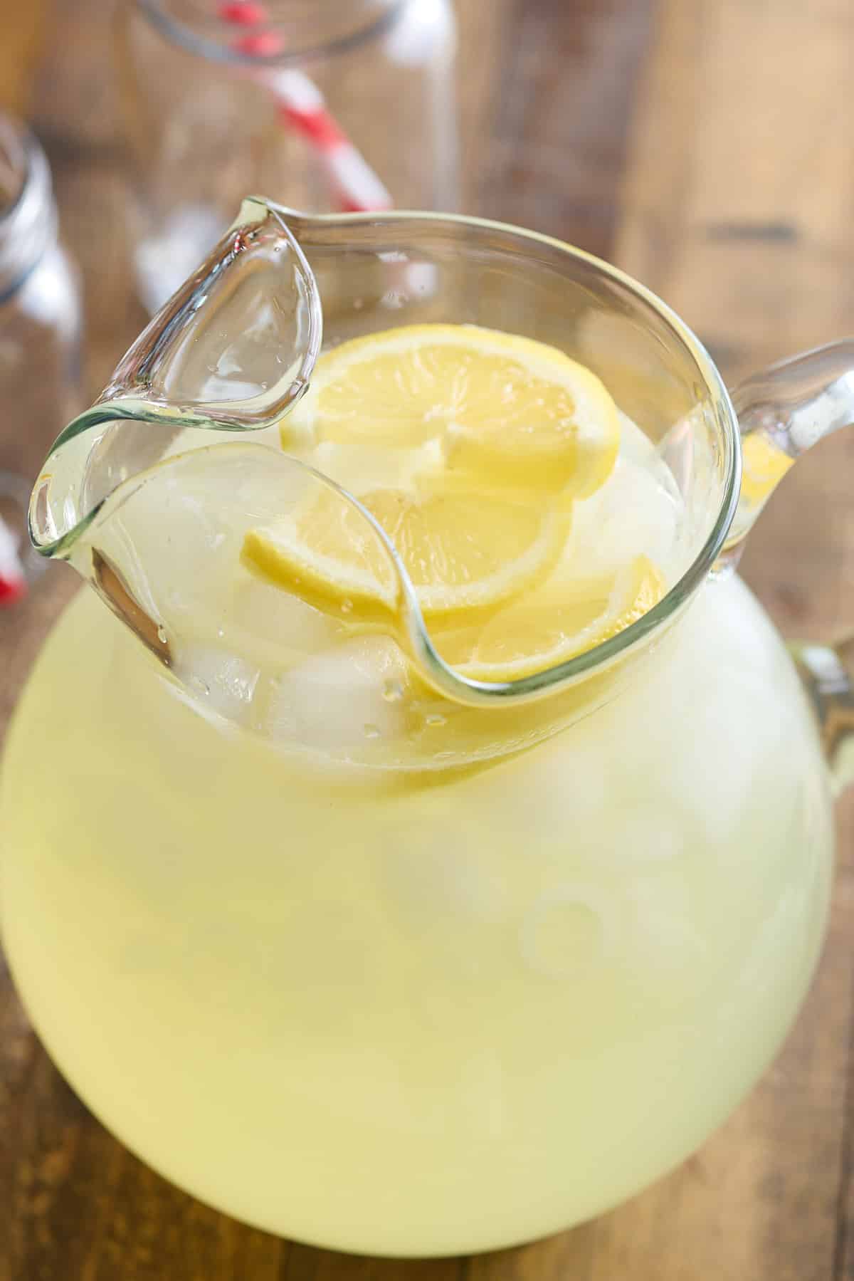 pitcher filled with classic lemon and topped with fresh lemon slices