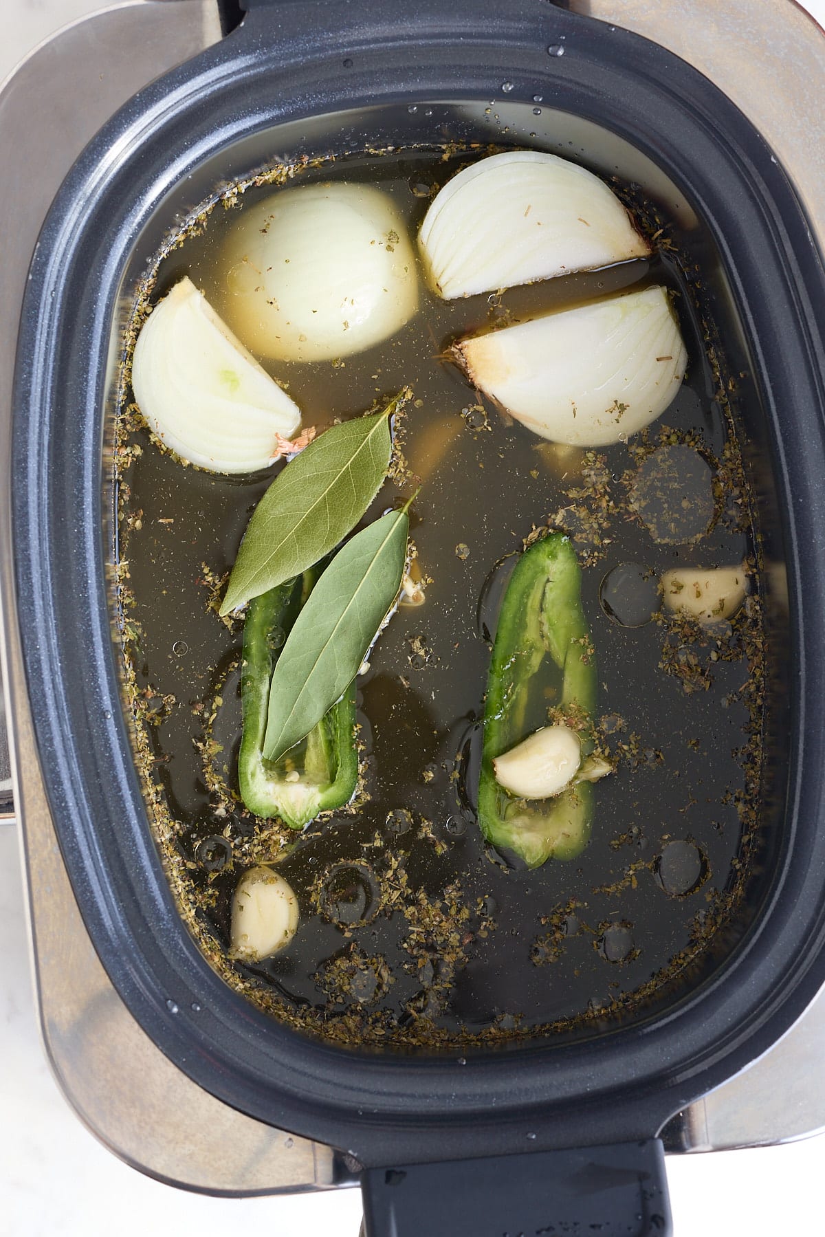 All ingredients added to a slow cooker.