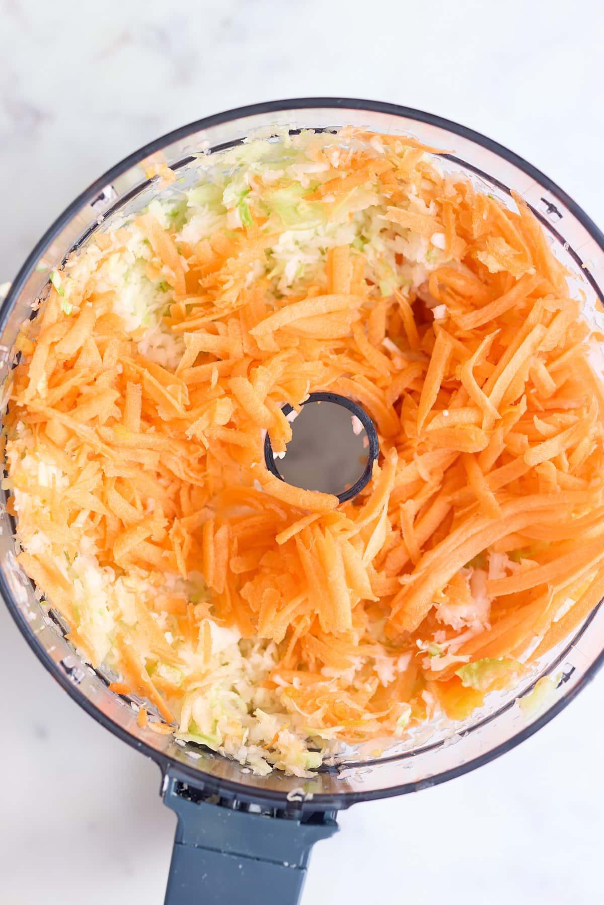 cabbage, carrots and pepper shredded in a food processor.