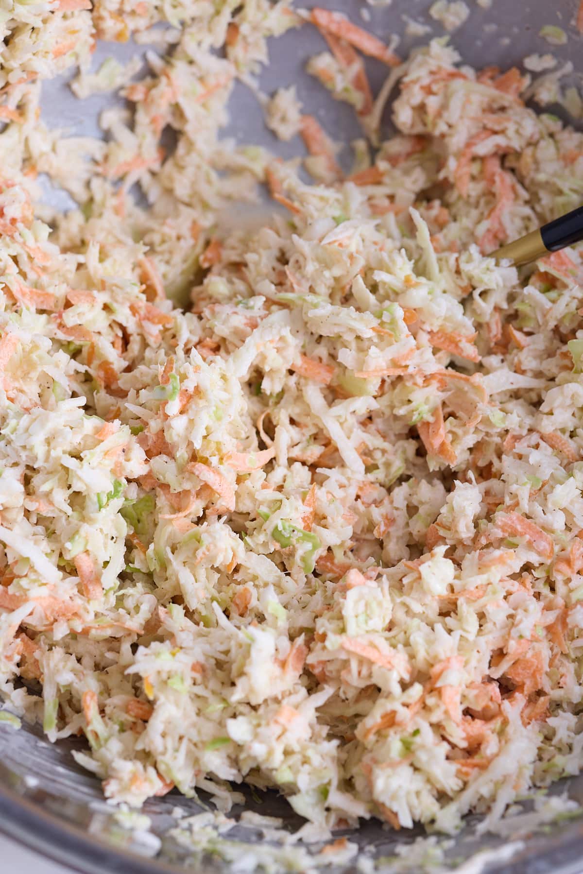 Jamaican coleslaw all mixed together with the dressing.