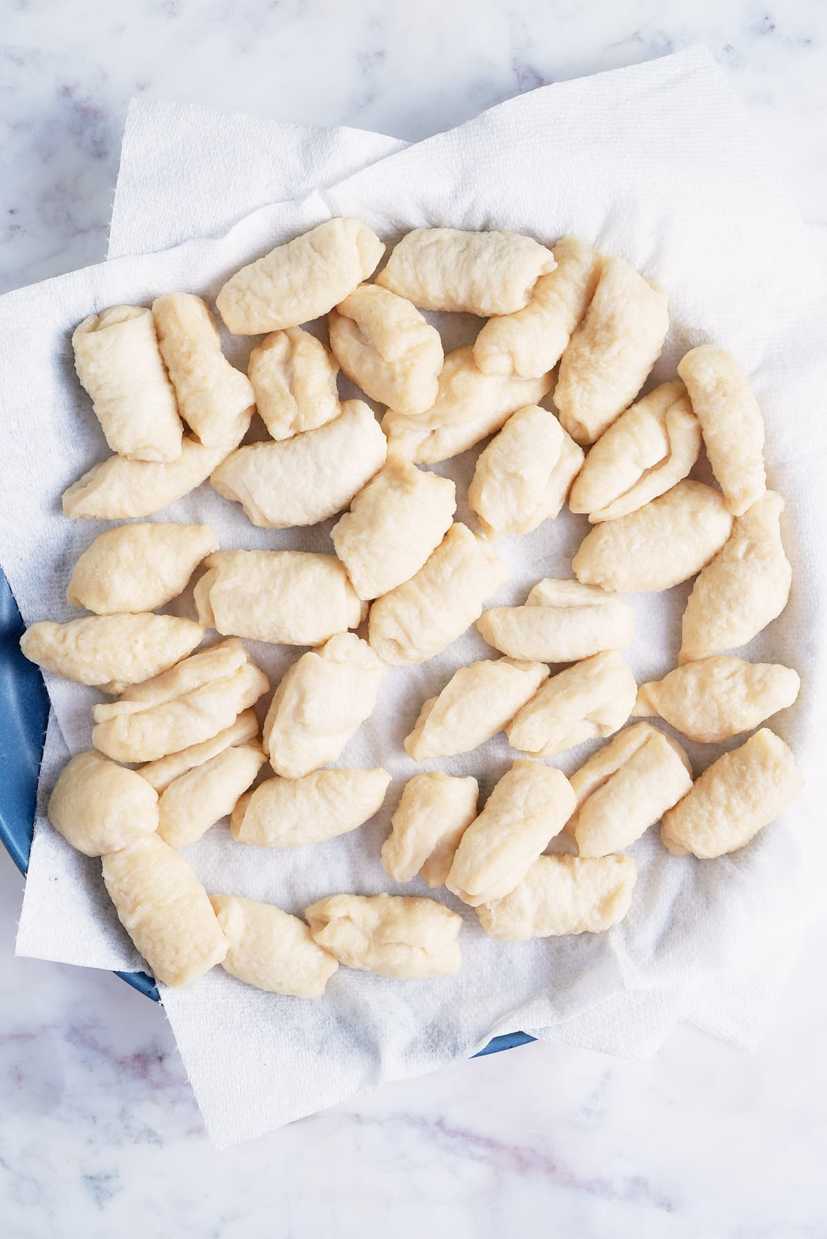 dough balls drying on some kitchen paper