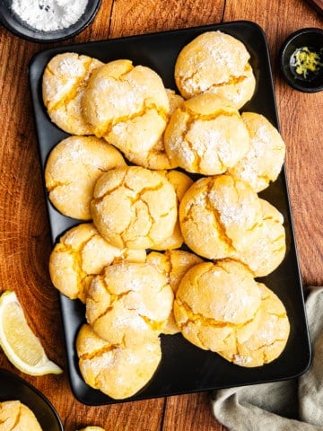lemon crinkle cookies on a baking sheet.
