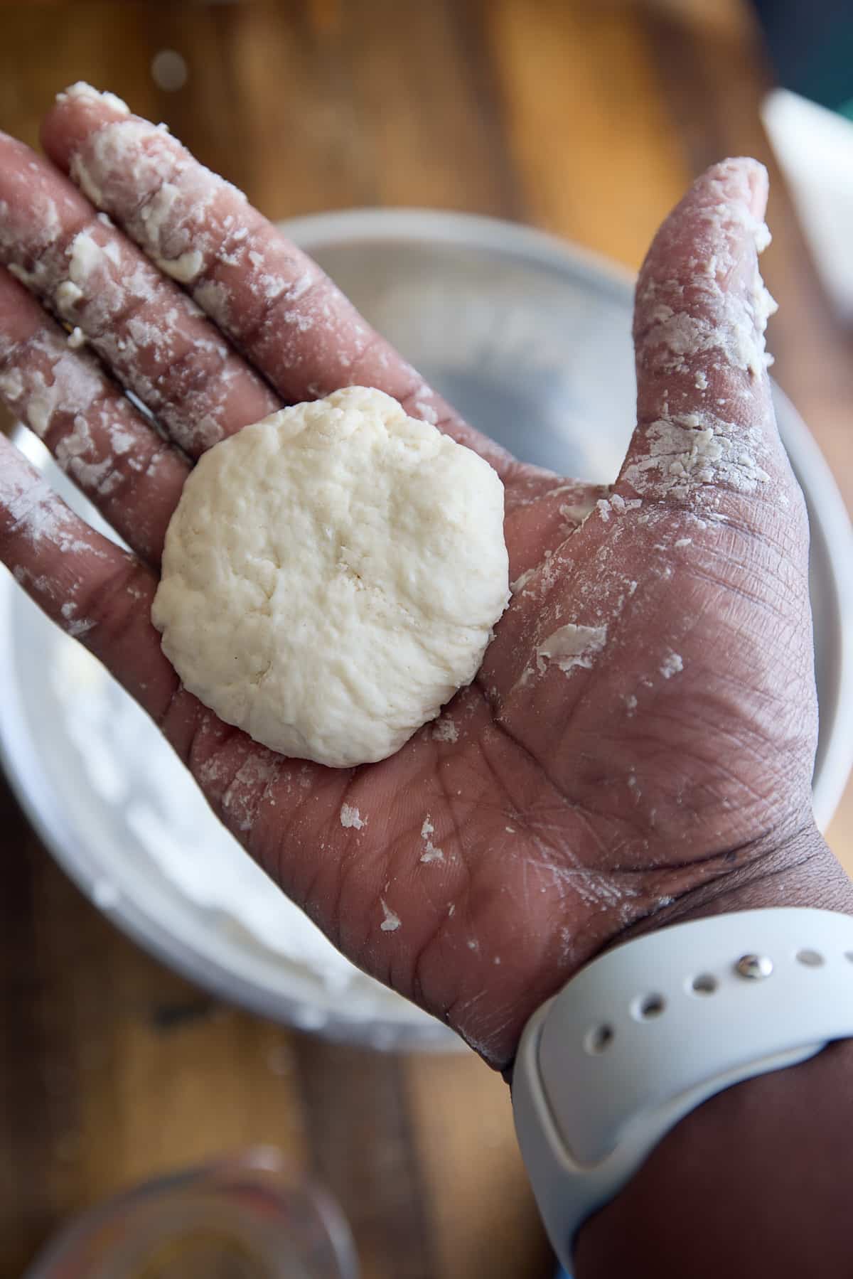 hand holding flattened dumpling
