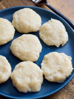 cooked jamaican dumpling on blue plate