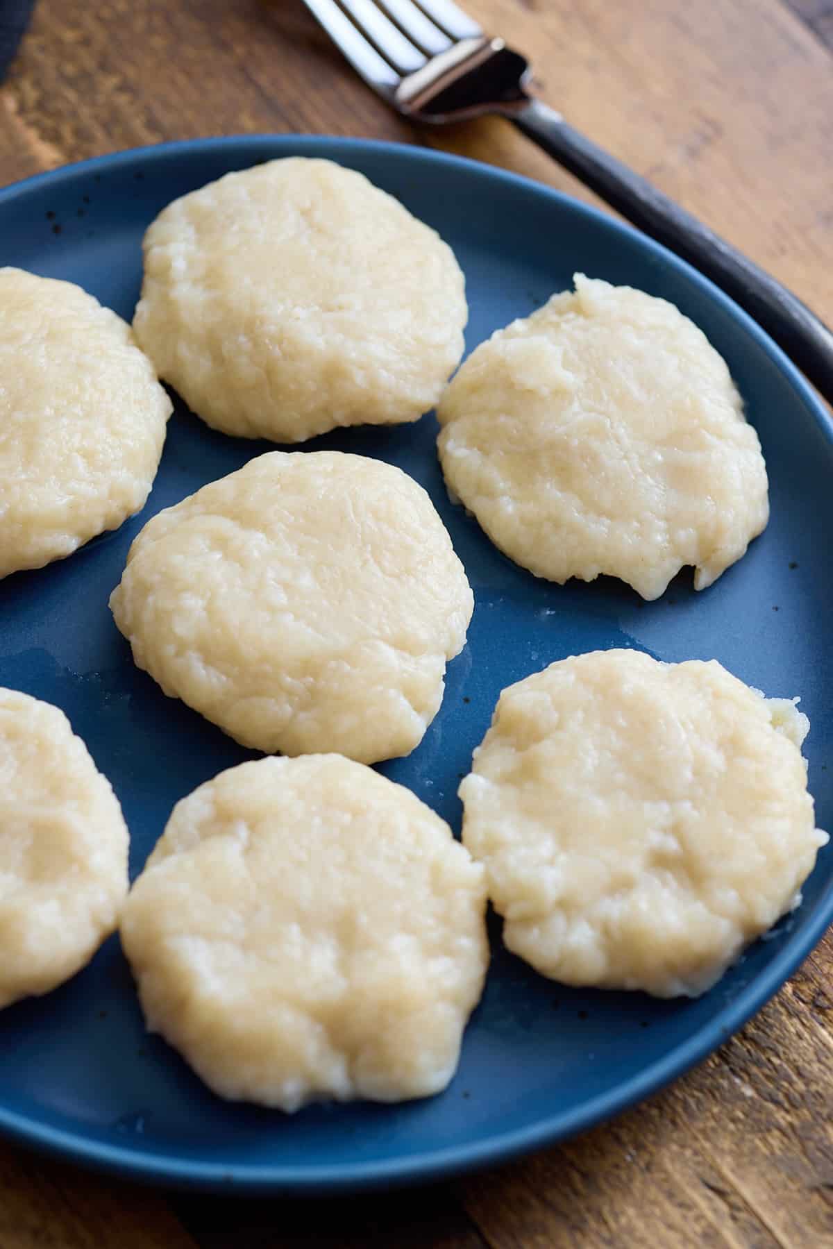 cooked jamaican dumpling on blue plate