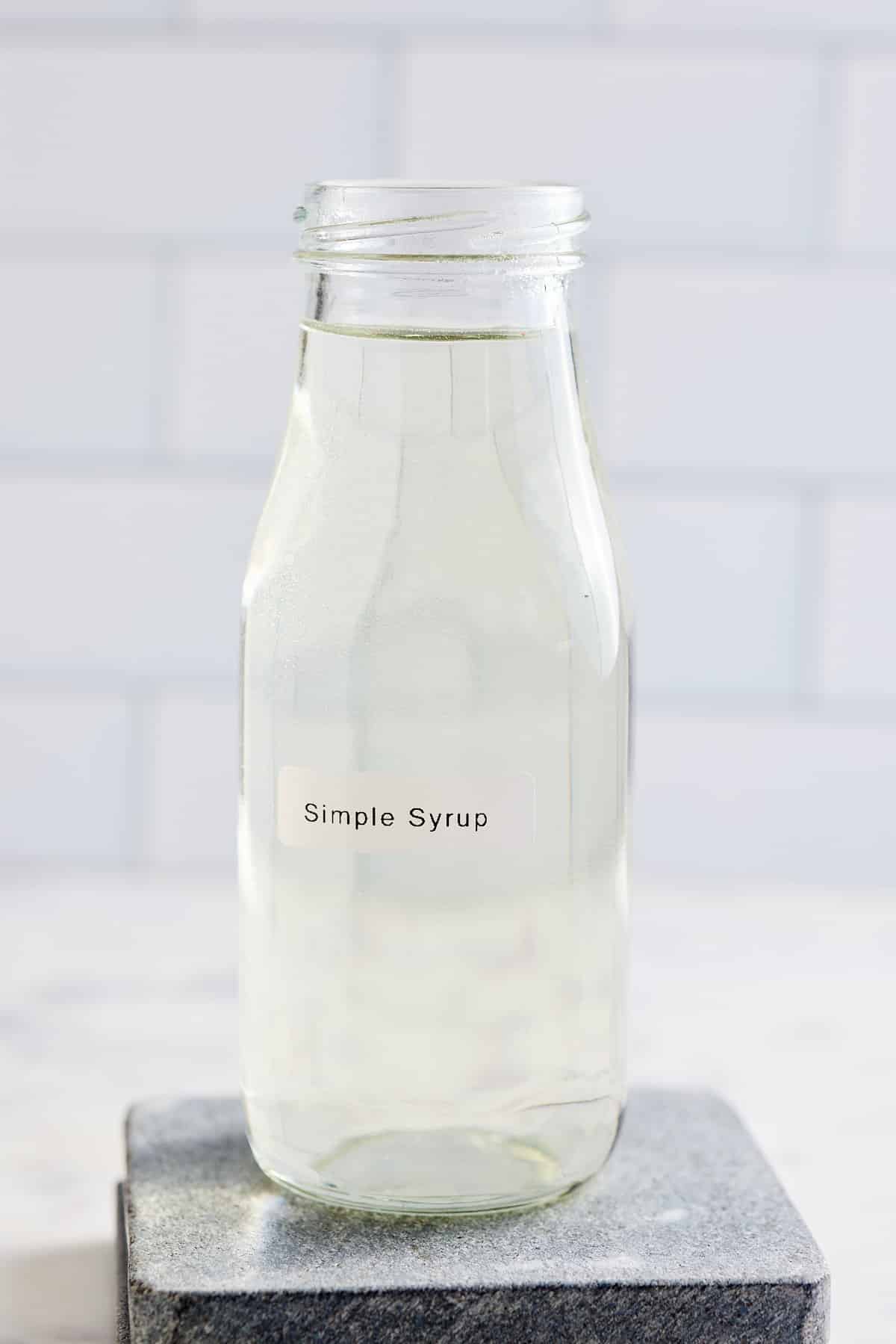 labeled glass bottle filled with simple syrup
