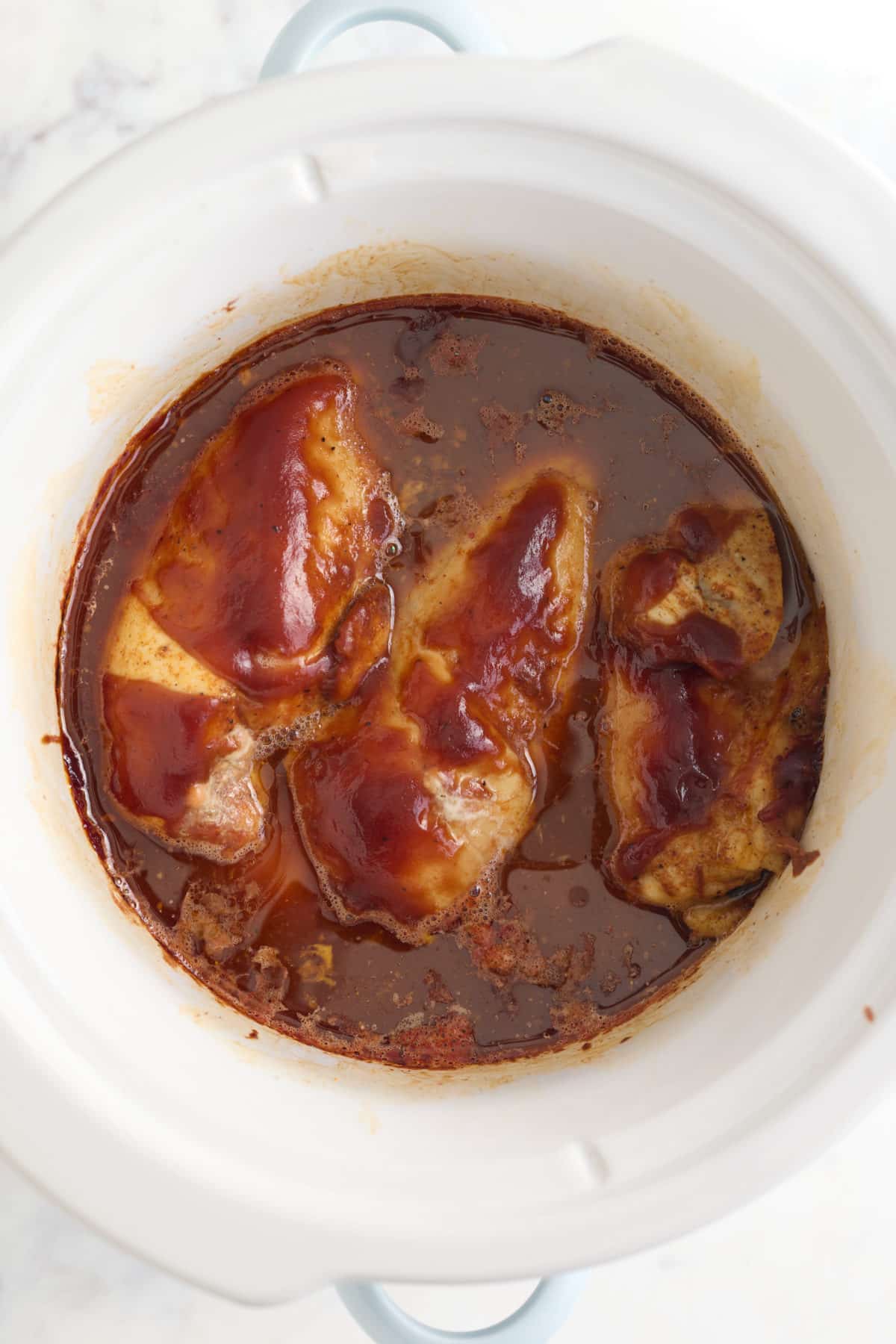 Cooked bbq chicken in the slow cooker.