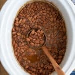 Slow cooker pinto beans cooked in the crock pot.