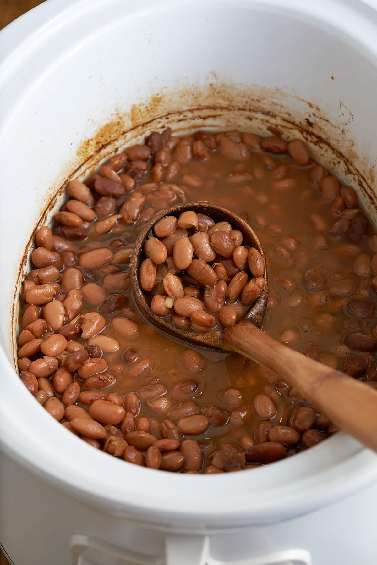 Slow cooker pinto beans cooked in the crock pot.