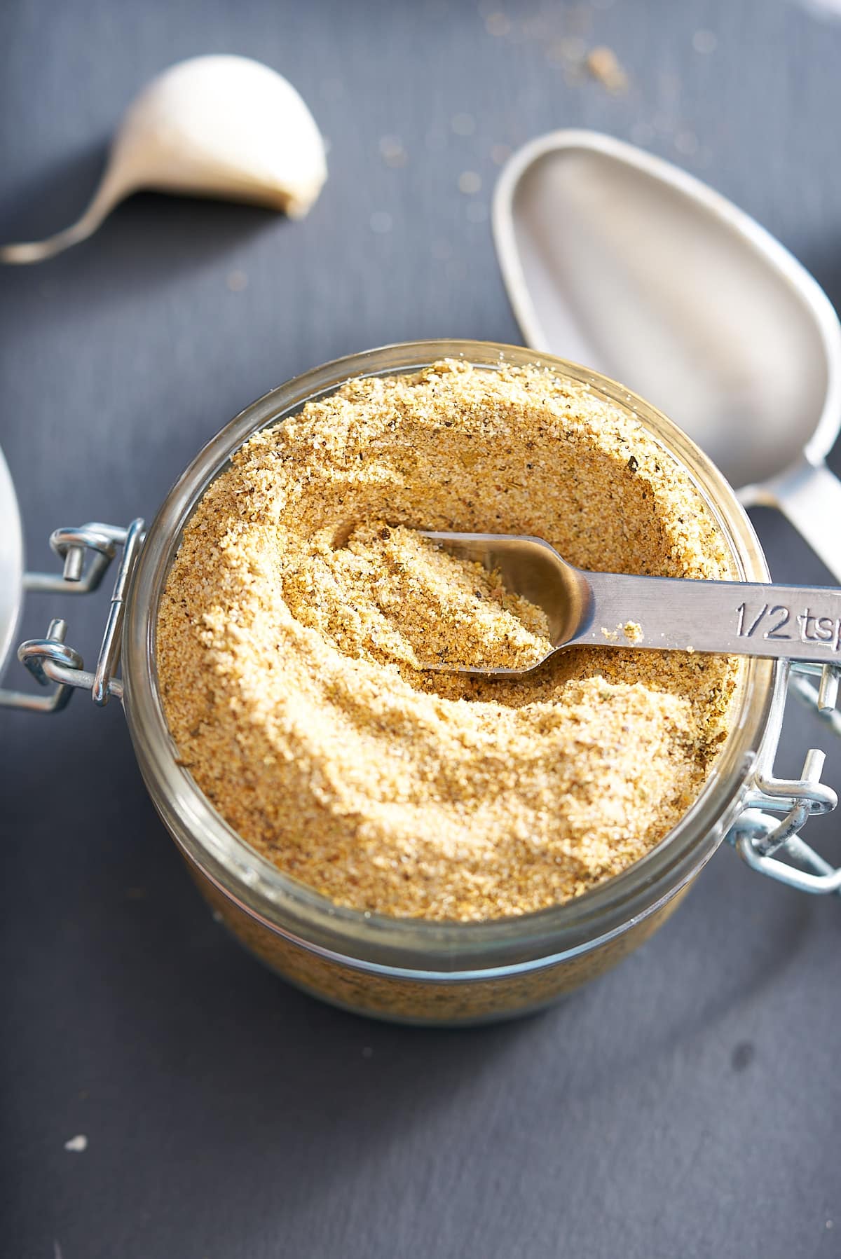 A jar of fresh prepared adobo seasoning.