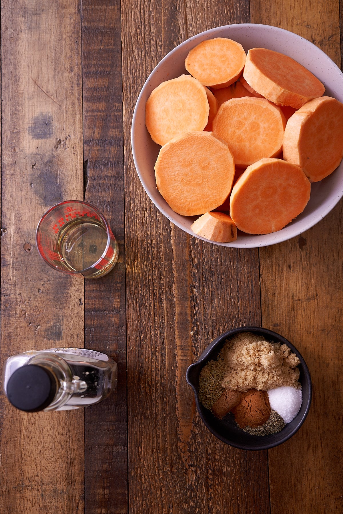 Baked sweet potato recipe ingredients set out in individual bowls.