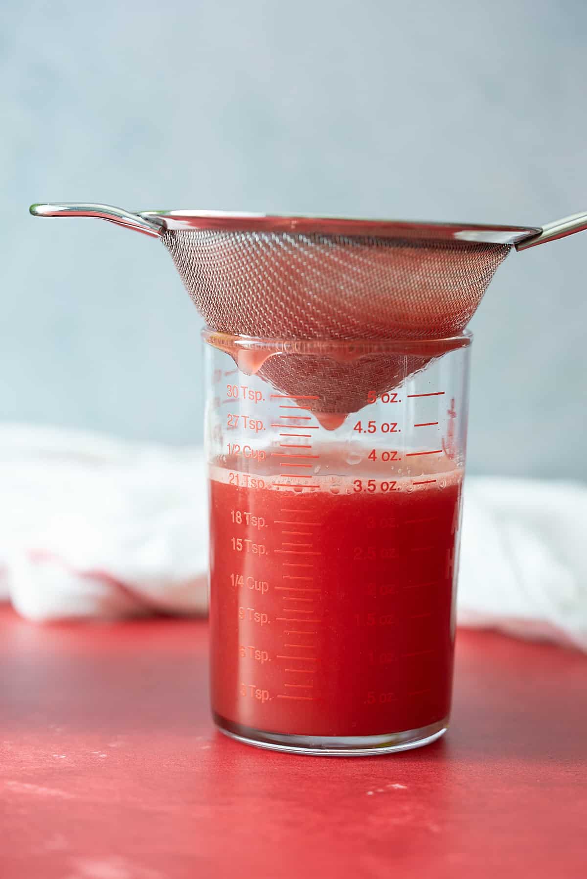 watermelon juice being strained.