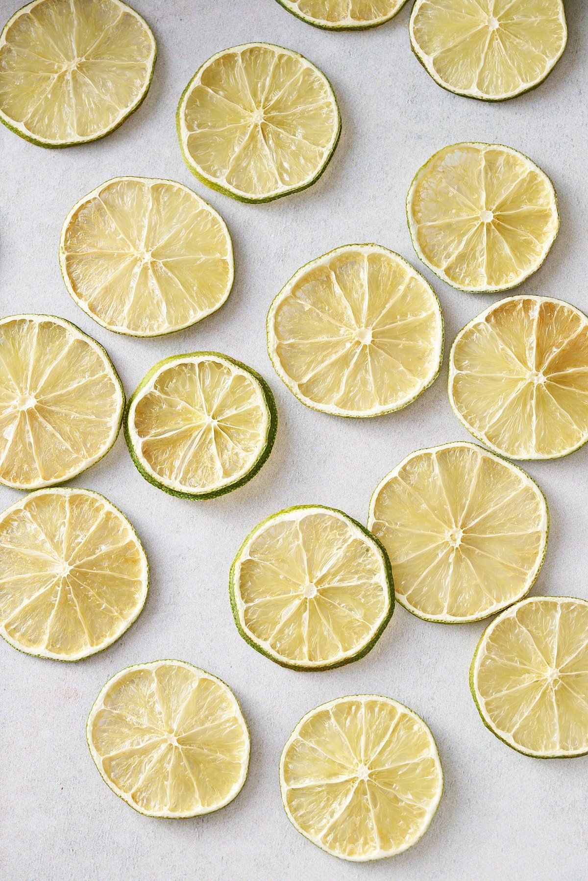 dehydrated limes laying on white table