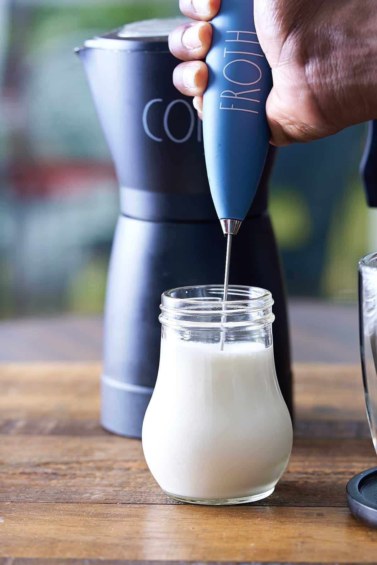 frothing cream in a small jar.