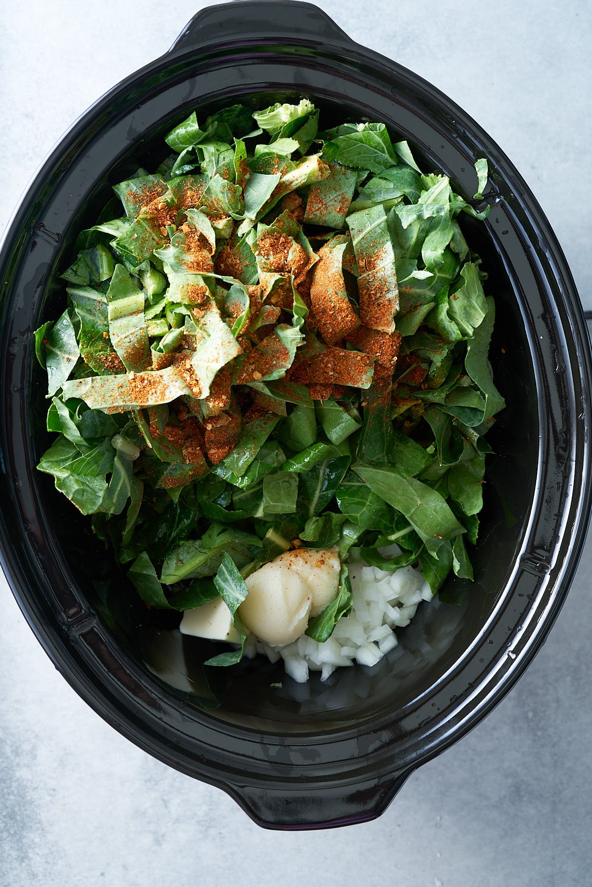 ingredients for collard greens in the slow cooker insert