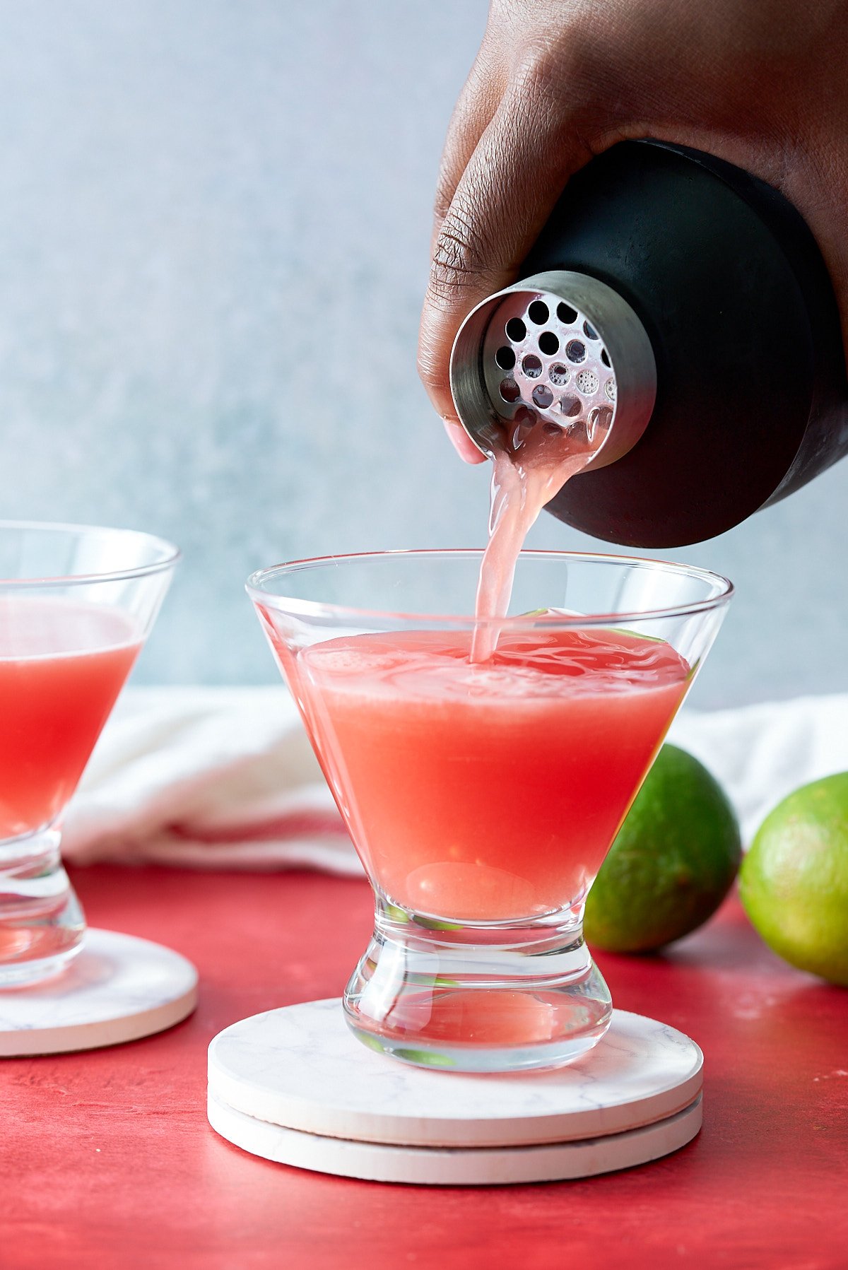 watermelon martini being poured into martini glass