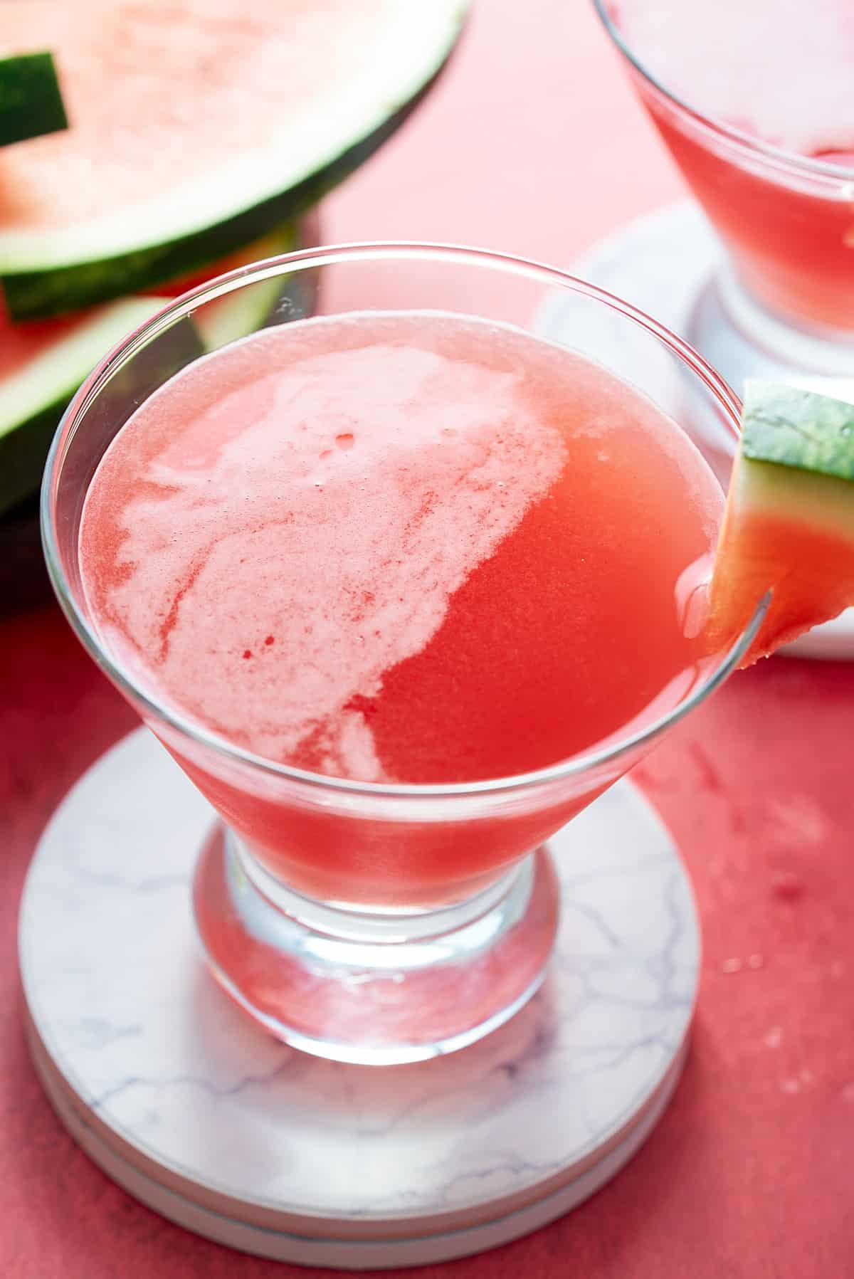 watermelon martini in martini glass, on top of coaster
