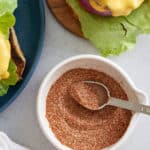 Hamburger seasoning in a small white dish.