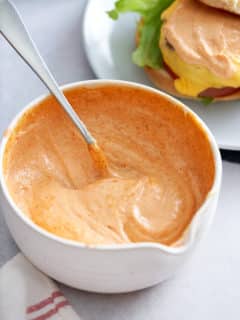 spicy mayonnaise mixed together and ready to serve in a white bowl.