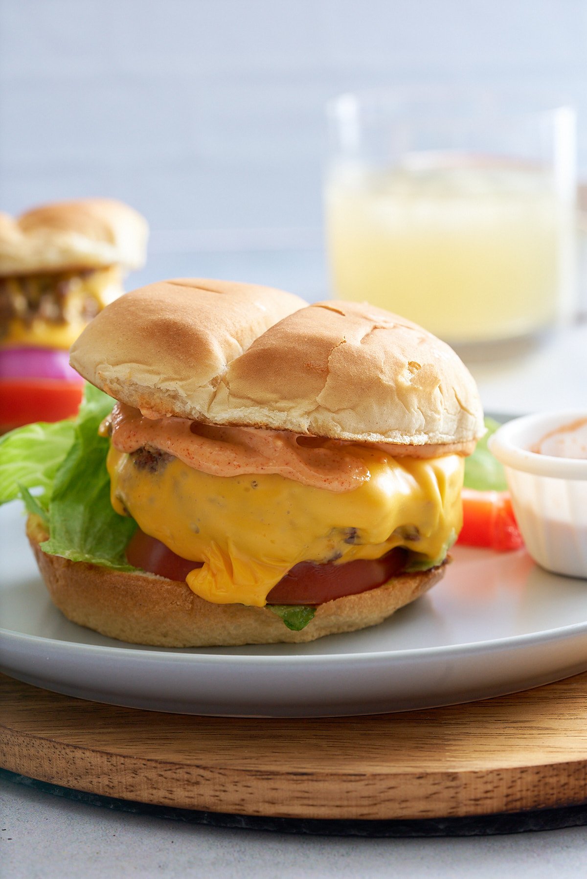 Close up of a prepared steamed cheeseburger with all of the toppings.