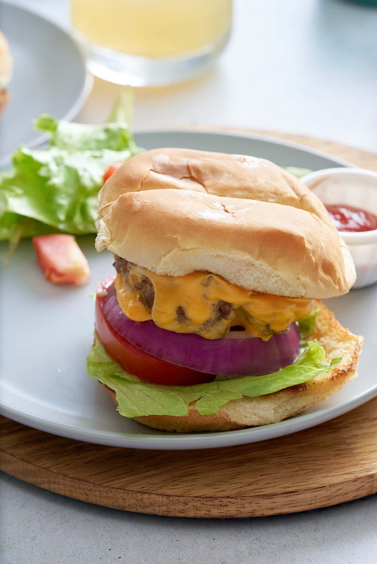 Close up of a prepared steamed cheeseburger with all of the toppings.