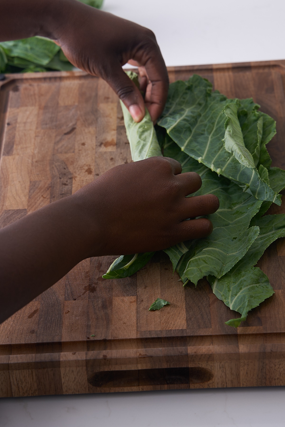 collard greens being rolled up