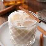 Bourbon milk punch served with a cinnamon stick.