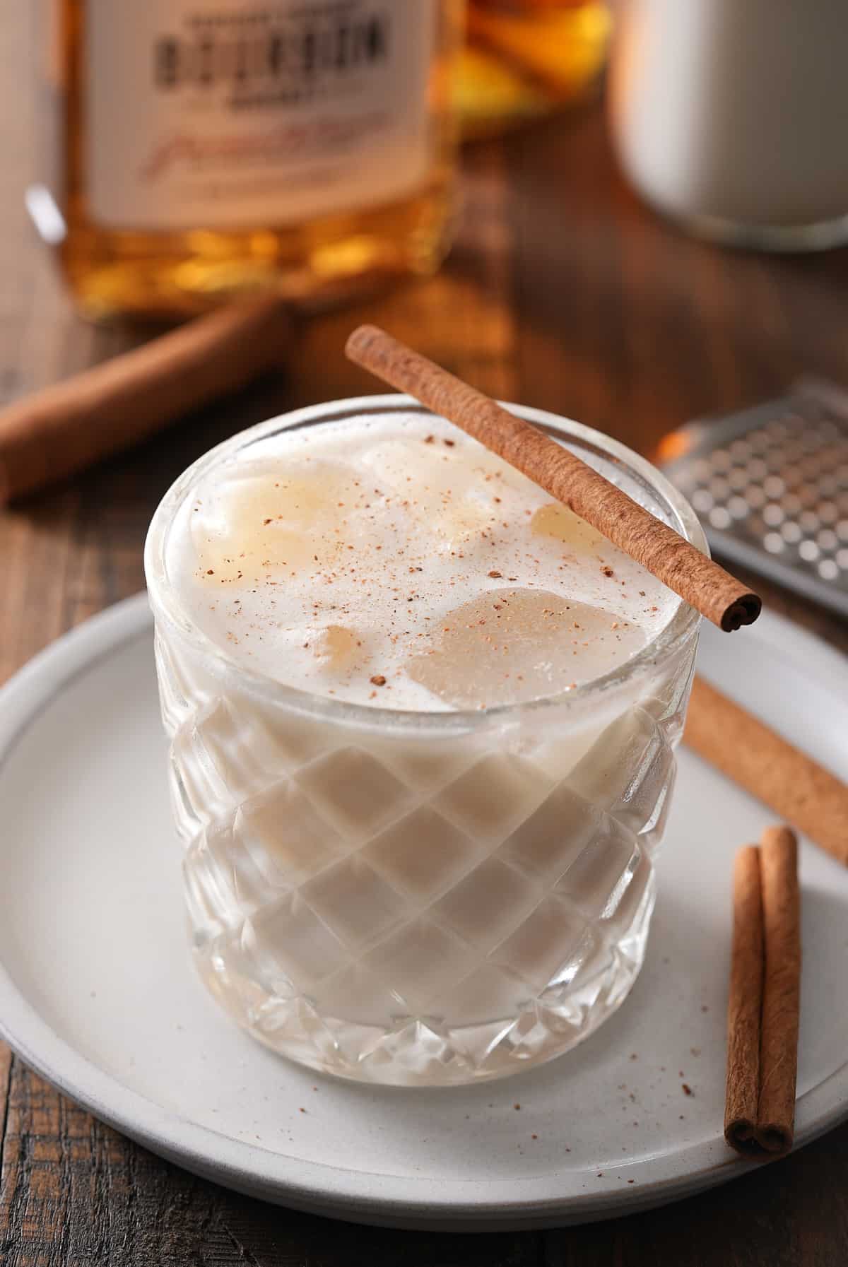 Bourbon milk punch served with a cinnamon stick.