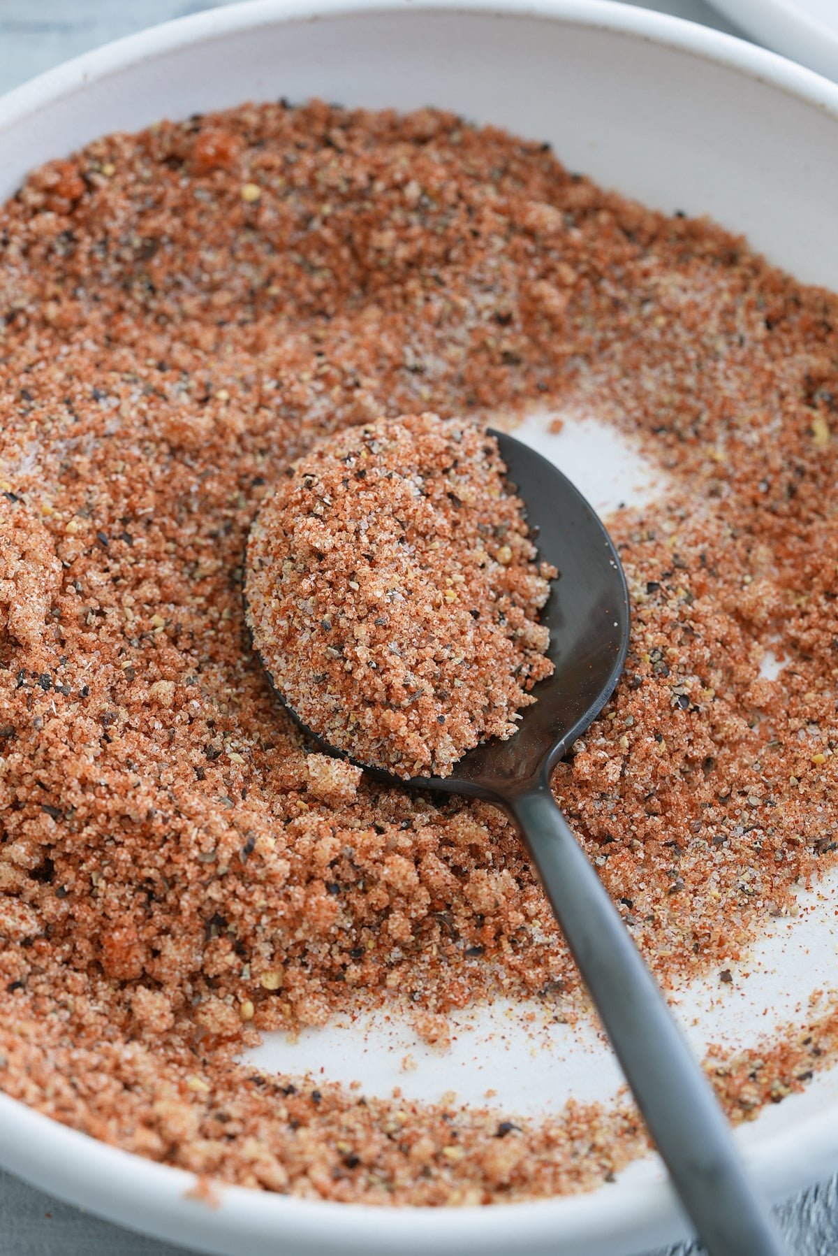 A white bowl filled with salmon seasoning.