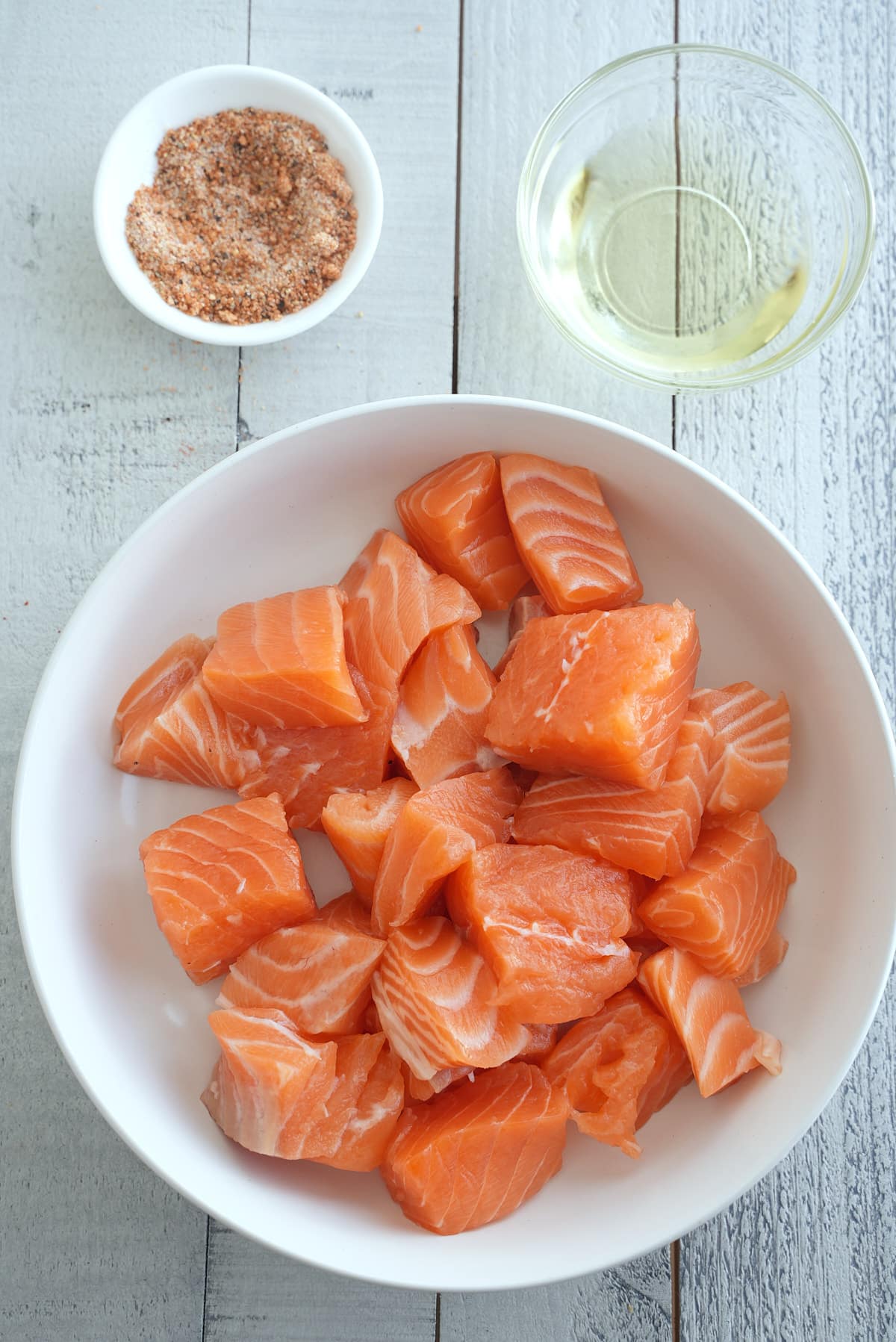 Air fryer salmon bites recipe ingredients set into individual bowls.