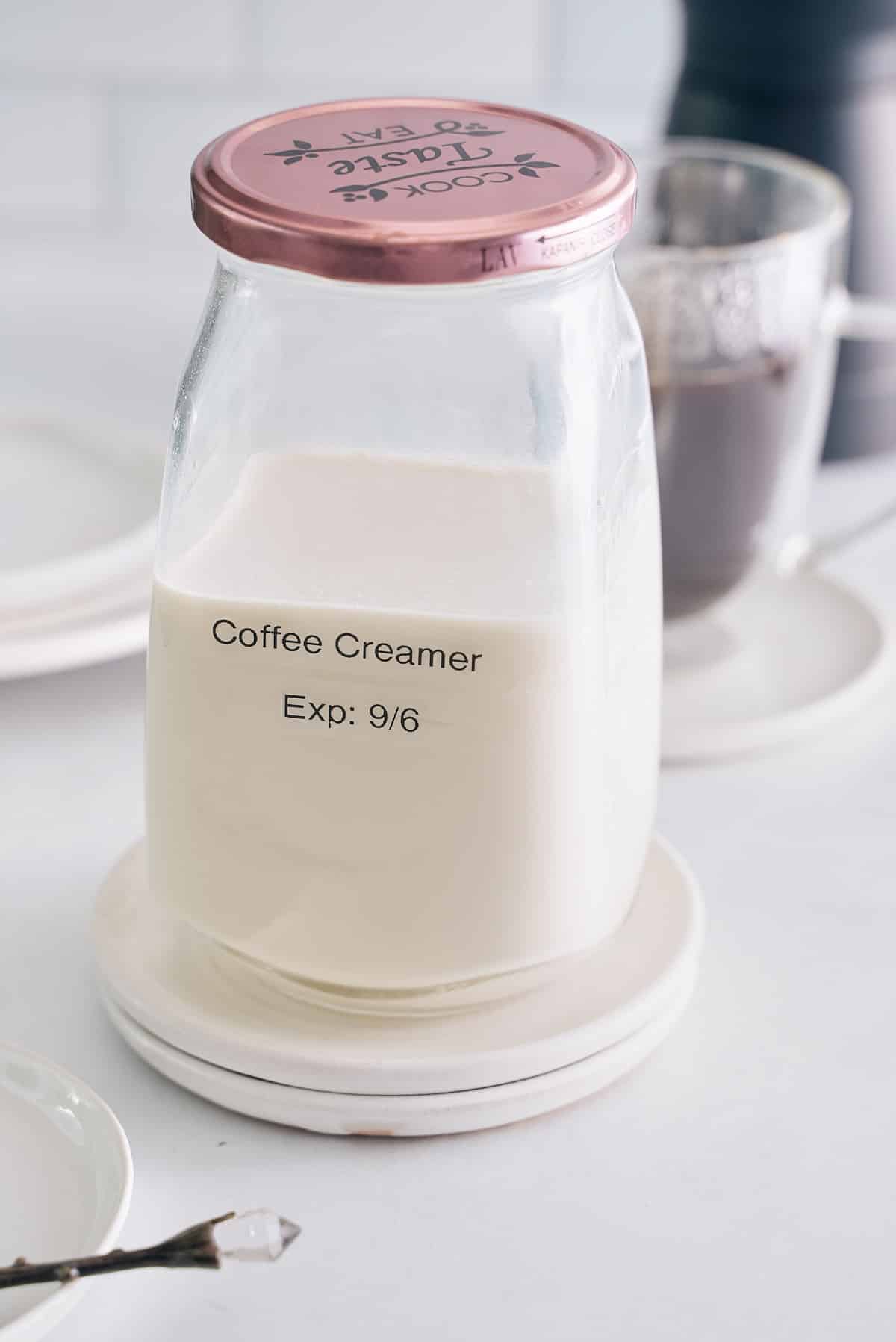 Sealed and labeled jar of homemade coffee creamer.