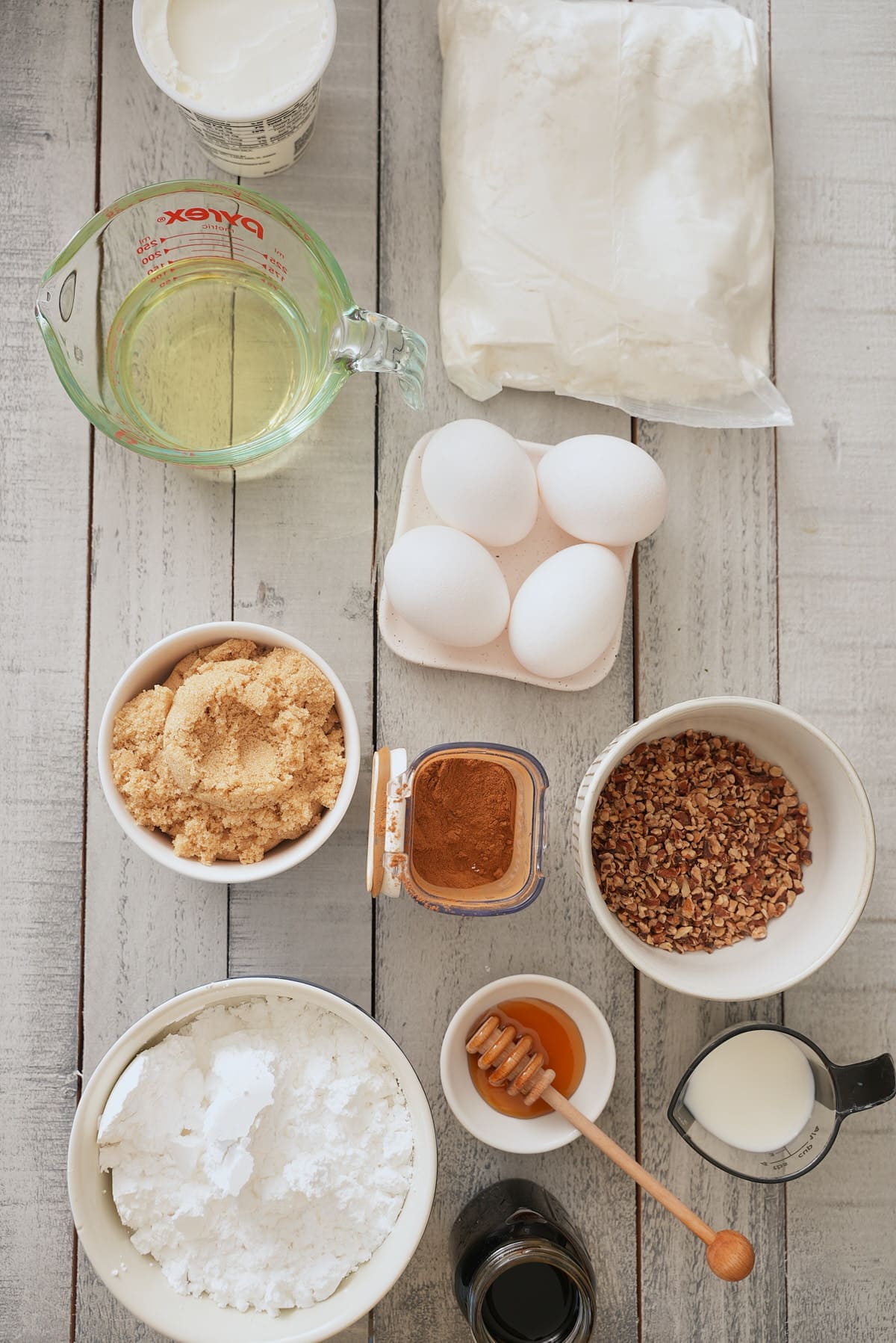 Honey bun cake recipe ingredients in individual bowls.