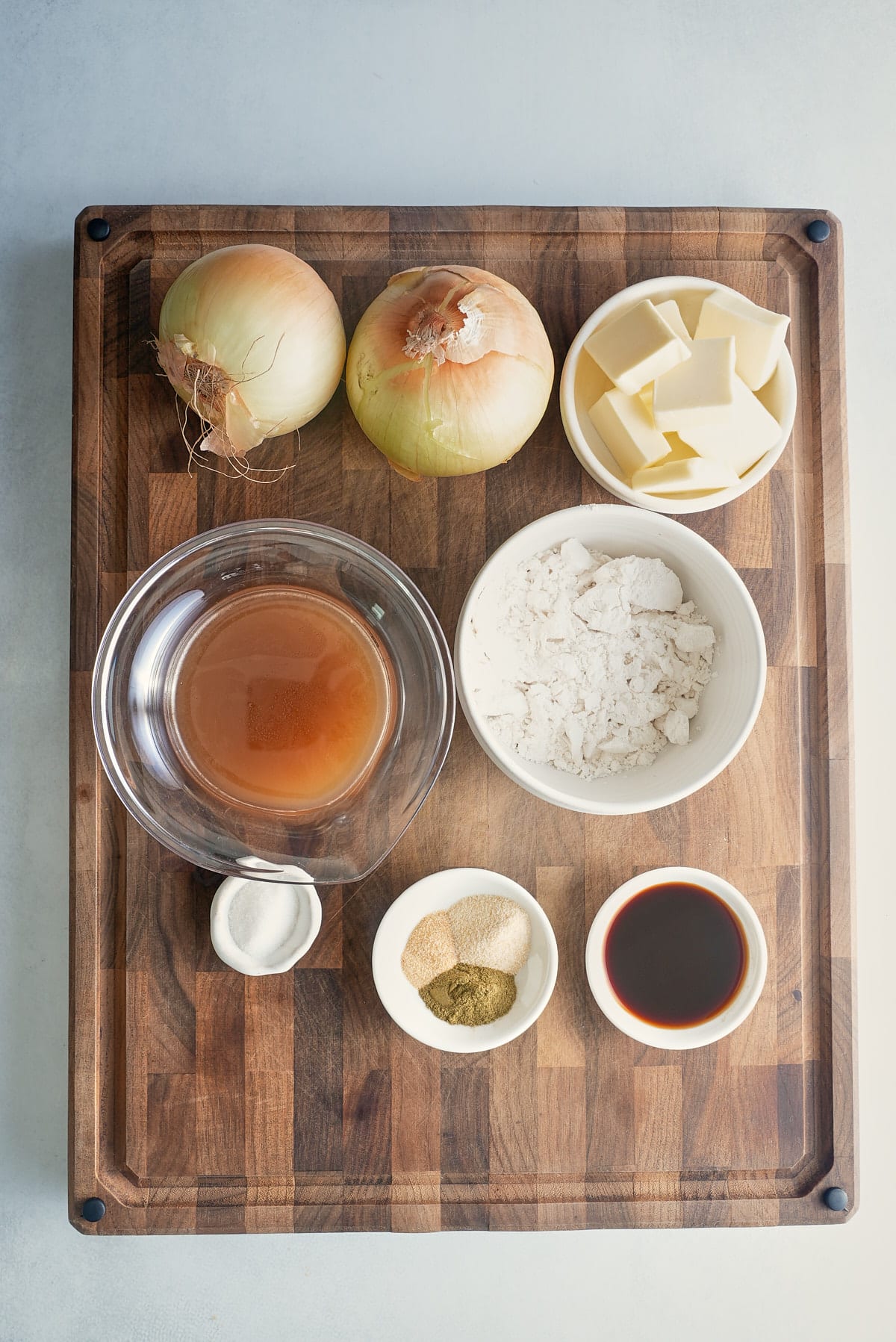Onion gravy recipe ingredients set into individual bowls.