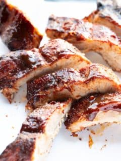 ribs that were made in the air fryer sitting on a white platter