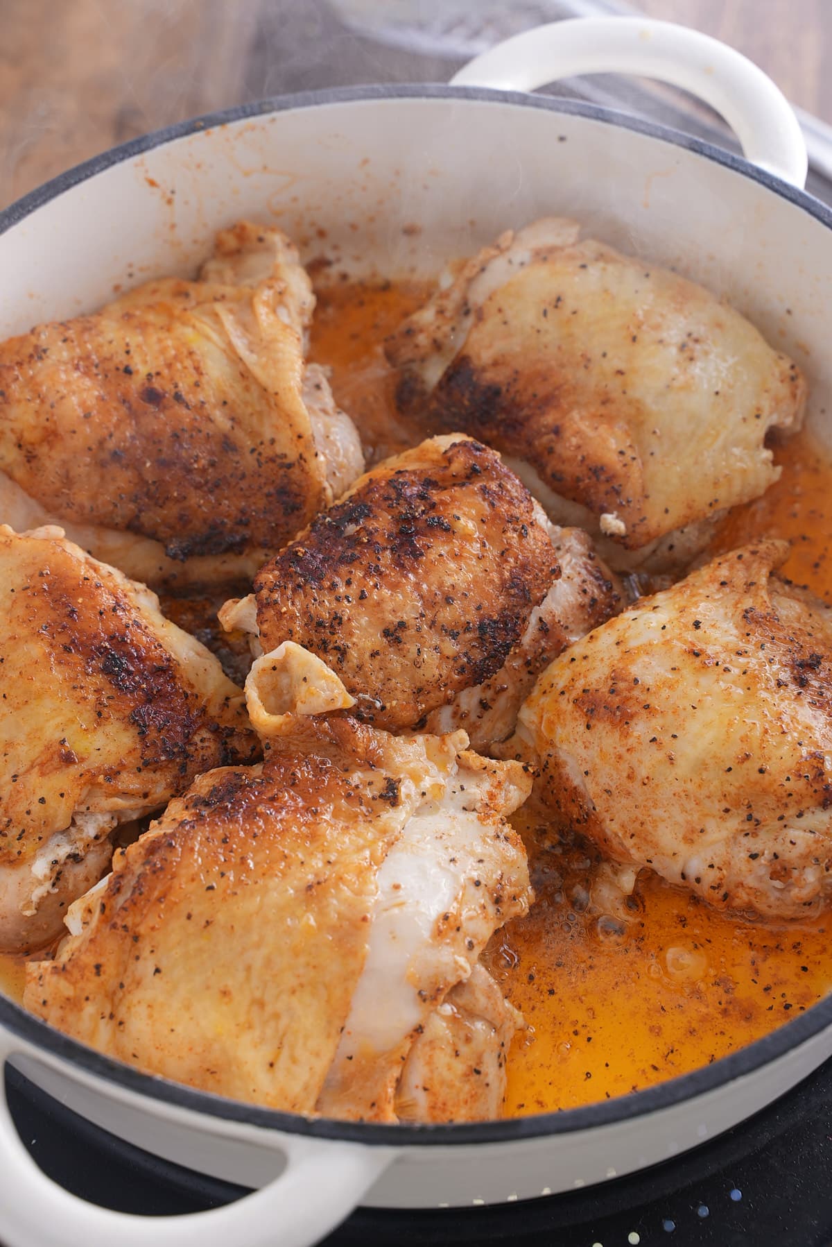 chicken thighs browning in pan