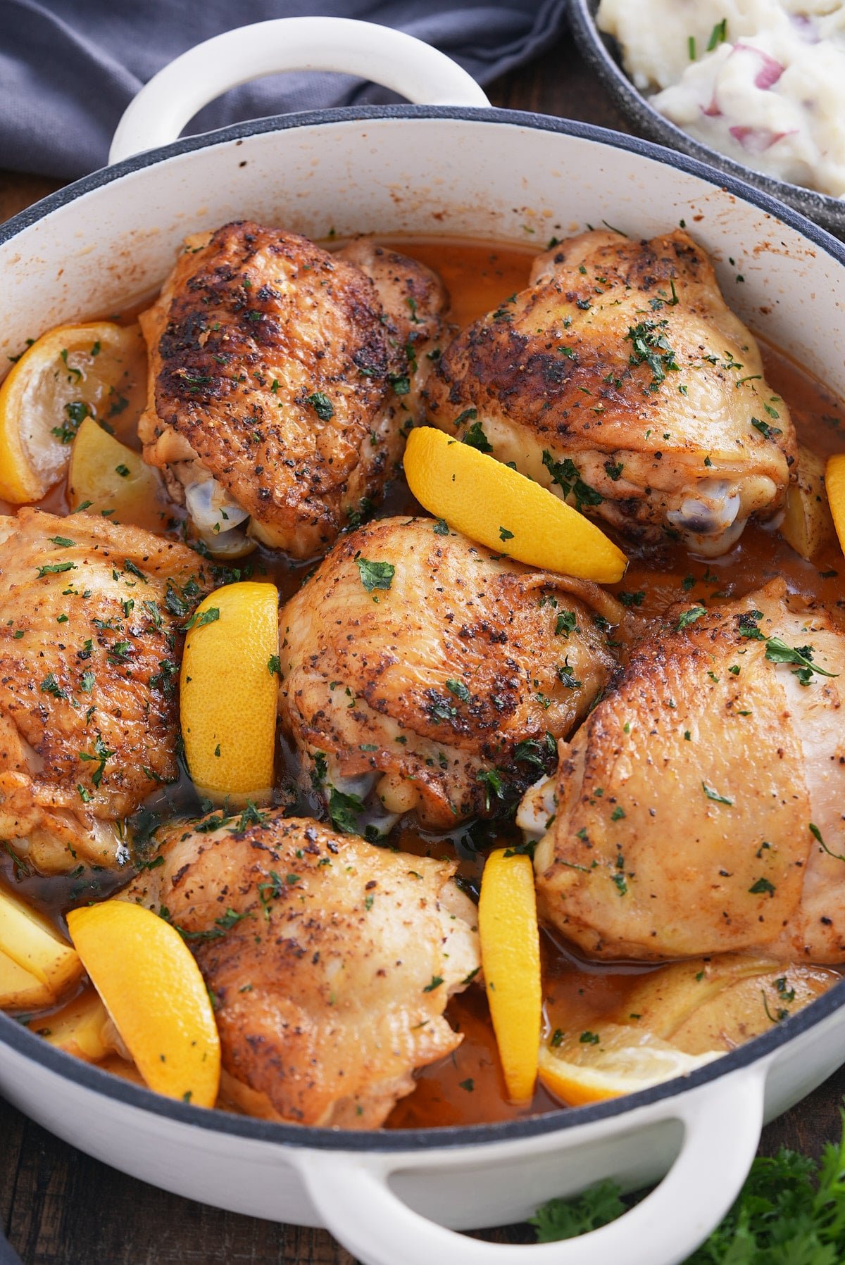 braised chicken thighs in white braising pan