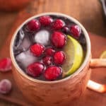 cranberry Moscow mule garnished with cranberries.