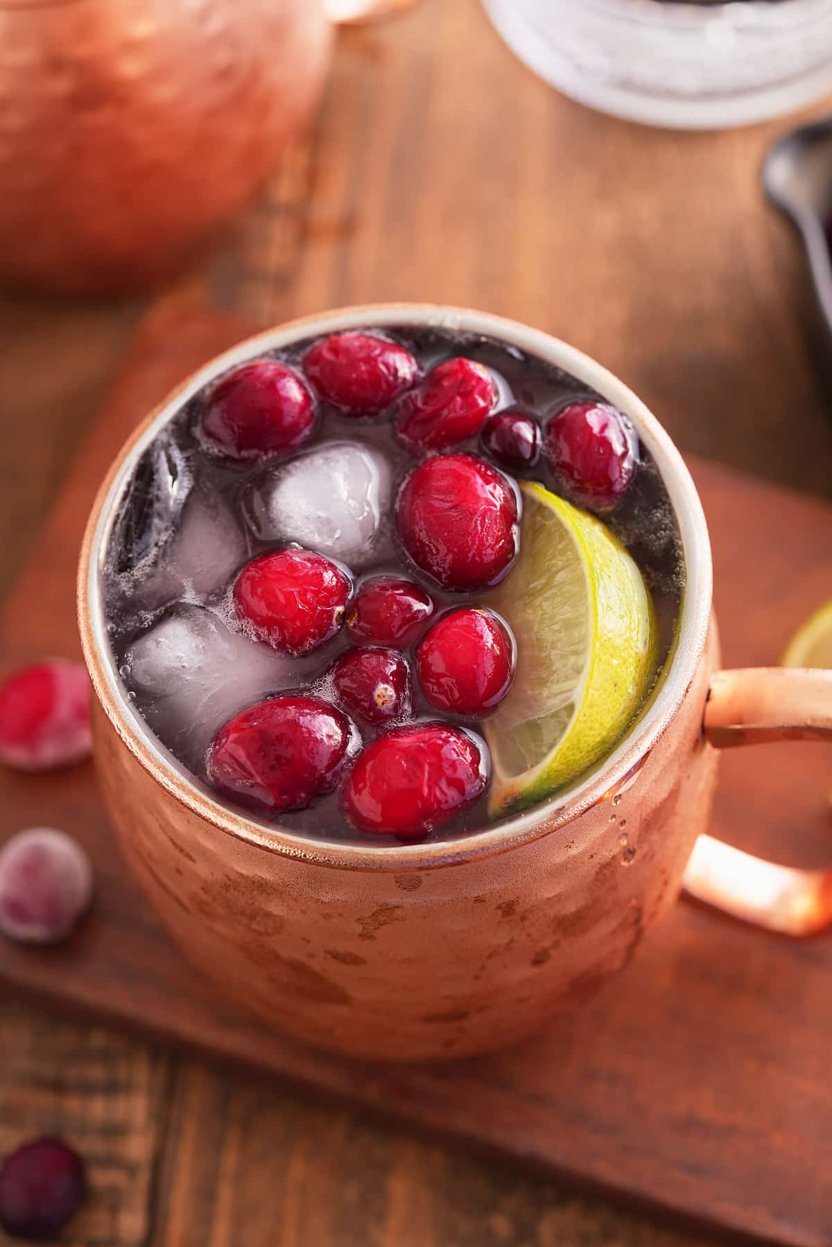 cranberry Moscow mule garnished with cranberries.