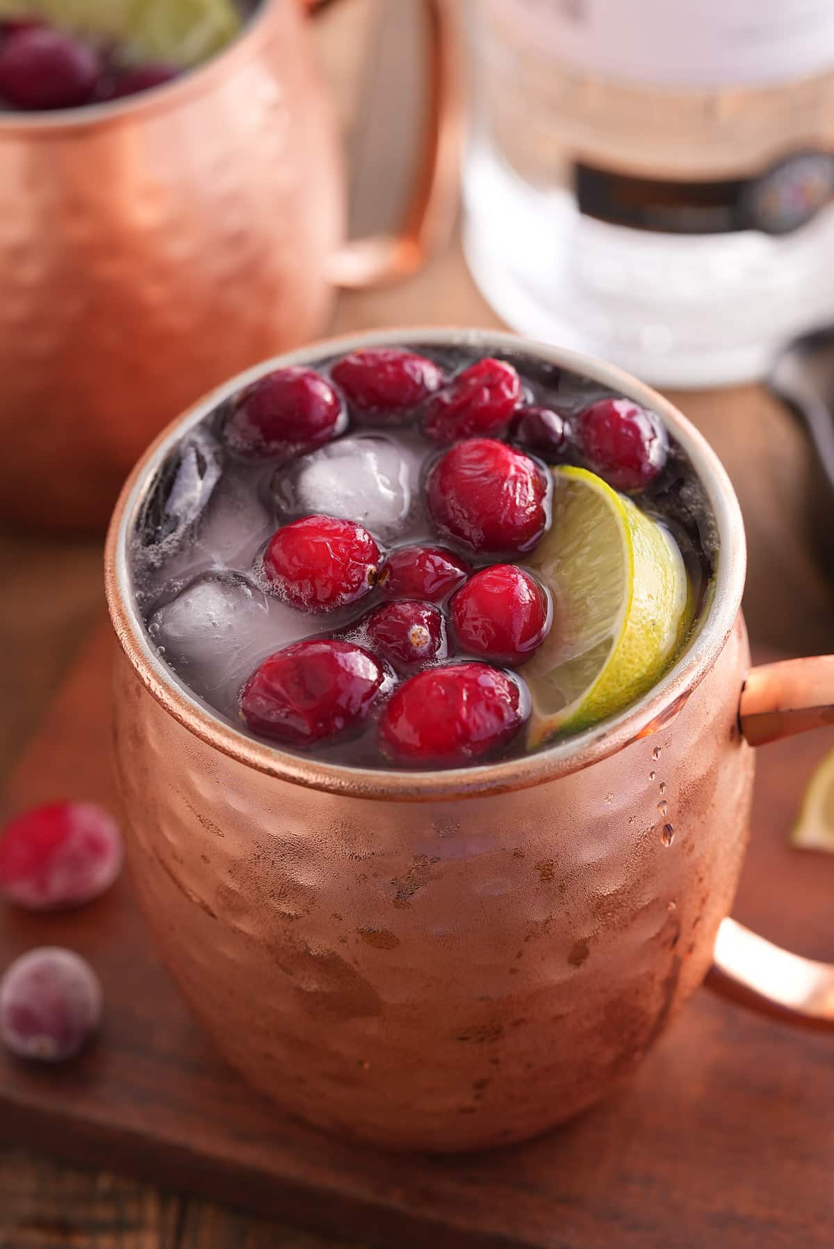 cranberry Moscow mule garnished with cranberries.