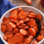 A bowl filled with sliced honey roasted carrots.