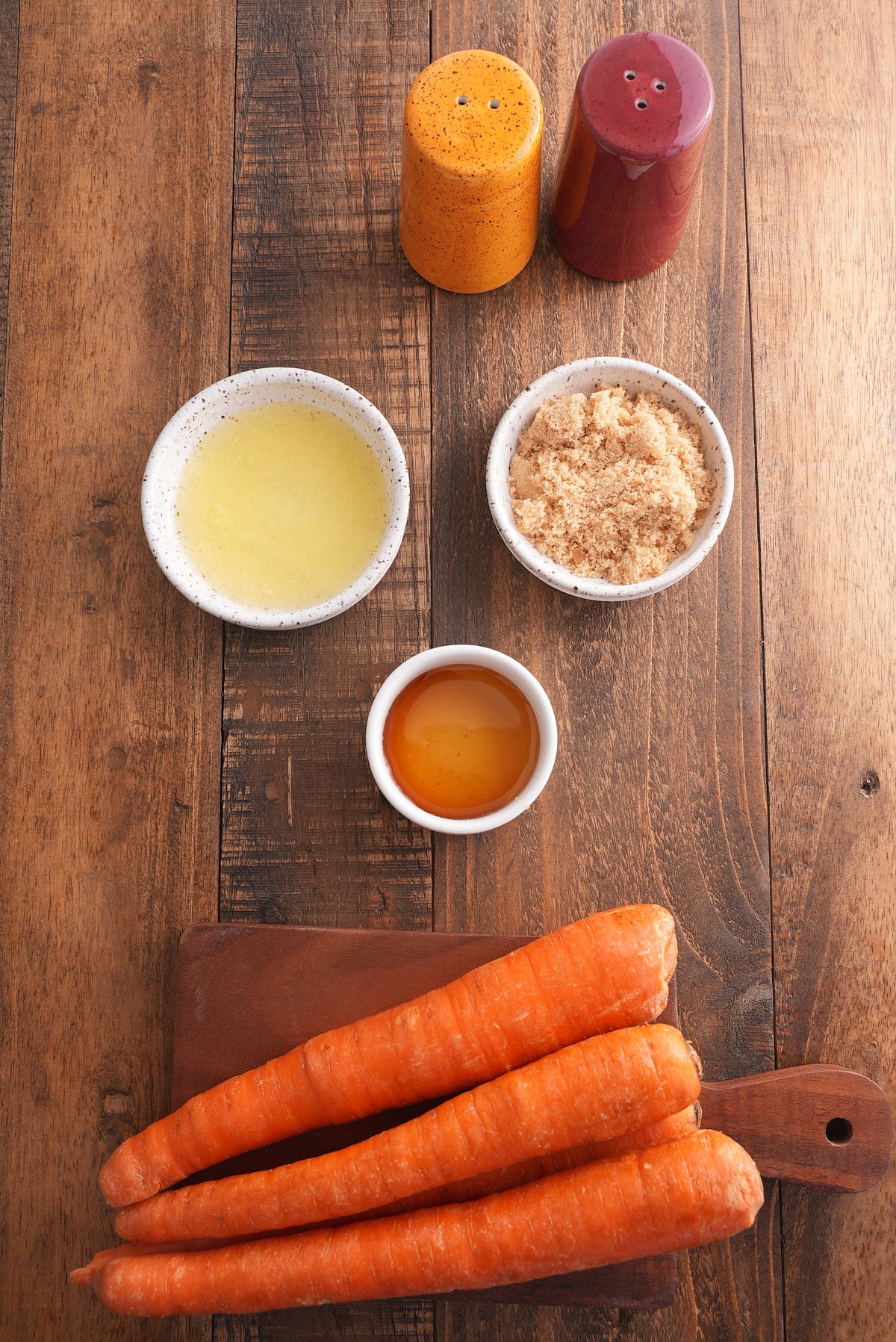 Honey roasted carrots recipe ingredients set into individual bowls.