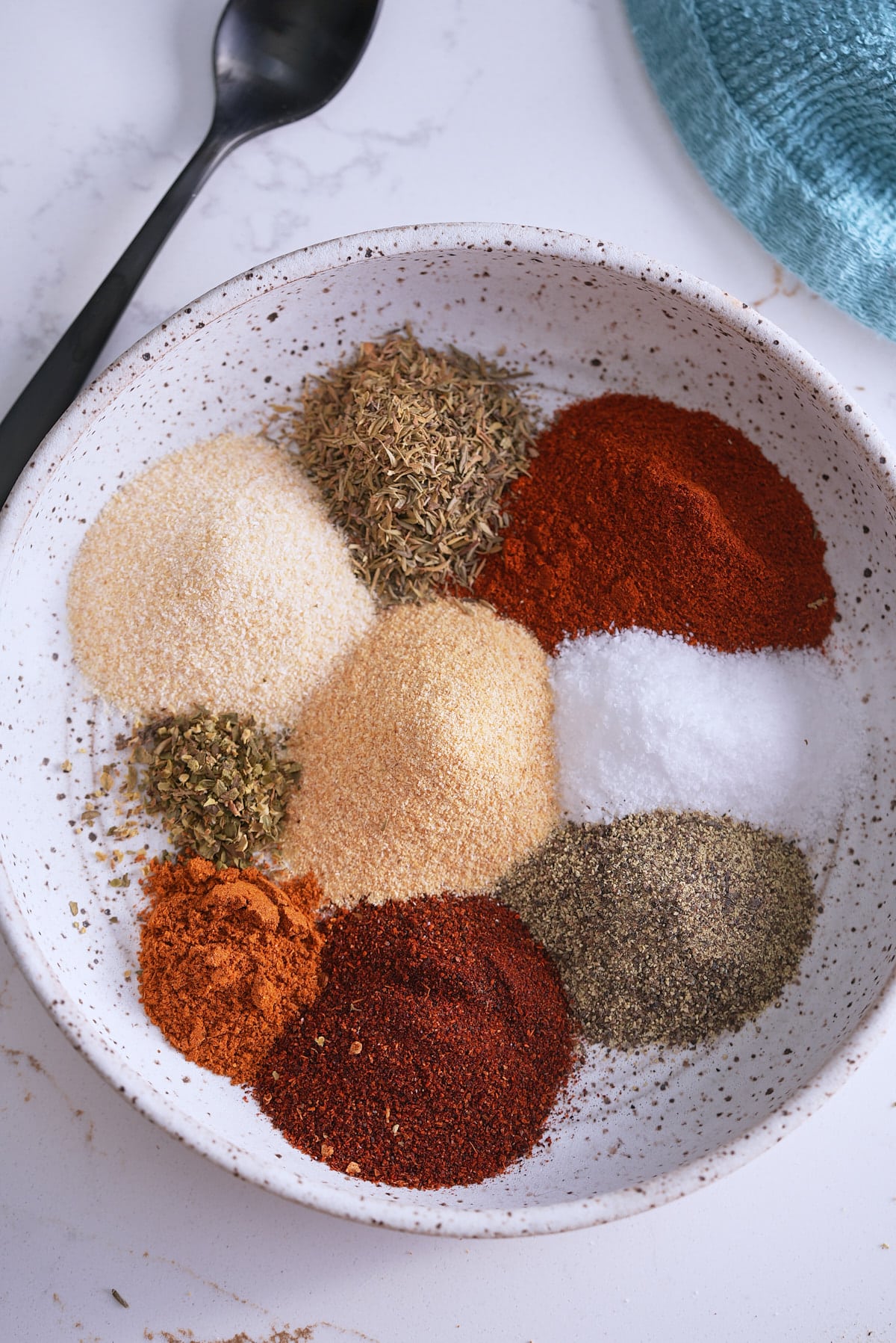 spices added to a bowl, not mixed.
