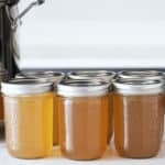 Jars of cooked and cooled turkey stock.