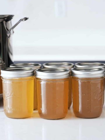 Jars of cooked and cooled turkey stock.