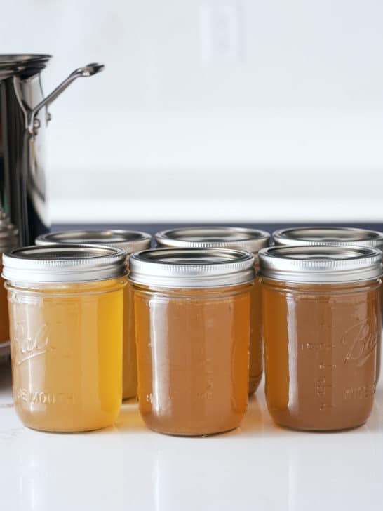 Jars of cooked and cooled turkey stock.